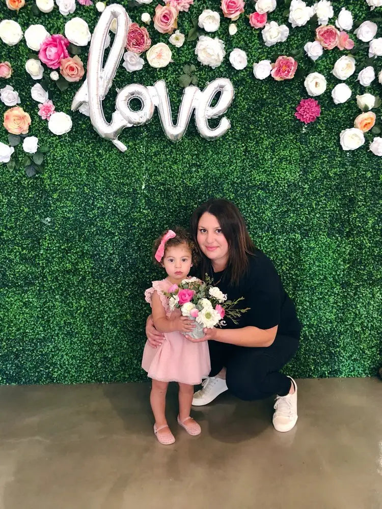 Floral wall display with love in script and roses by Blueberry Blooms in San Diego.