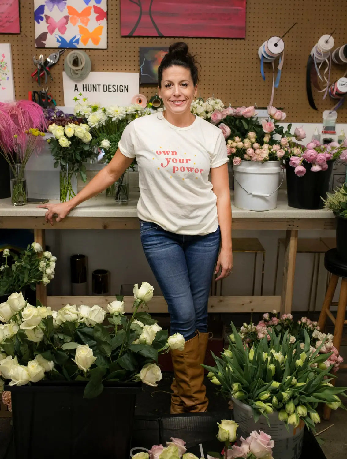 Florist Andrea Hunt-Shelton with an incredibly supportive husband among fresh flowers.