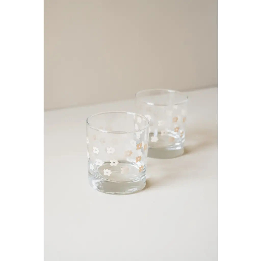 Two clear glass tumblers filled with drinks in a Heavy-based 11oz Checkered Cocktail Glass