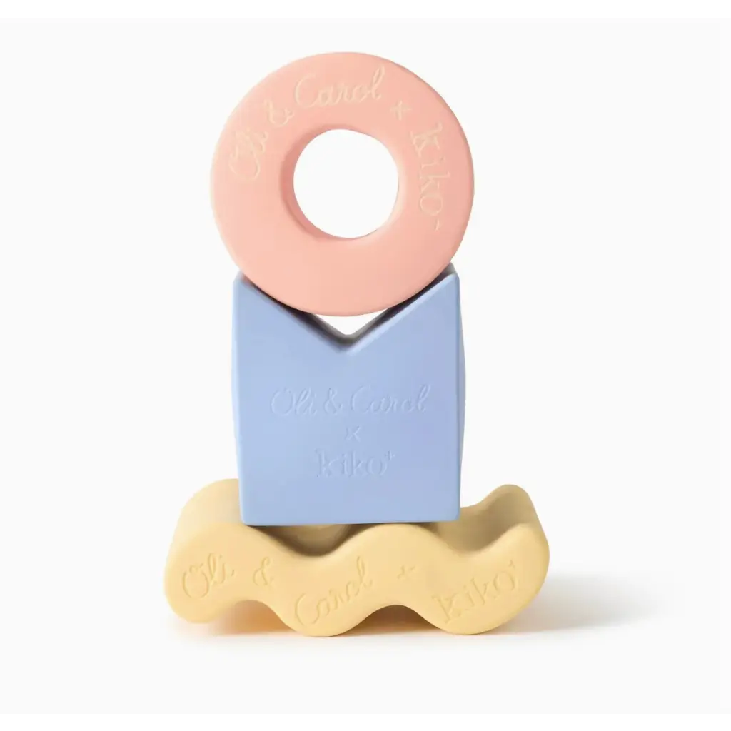 Colorful pastel geometric figures in natural rubber forming a cute stacking tower