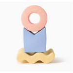 Colorful pastel geometric figures in natural rubber forming a cute stacking tower