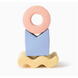 Colorful pastel geometric figures in natural rubber forming a cute stacking tower