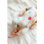 Baby sleepwear featuring colorful smiley faces on the All Smiles Bamboo Baby Sleeper