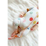 Baby sleepwear featuring colorful smiley faces on the All Smiles Bamboo Baby Sleeper