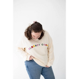 Cream-colored sweatshirt with vibrant ALREADY GOOD text in organic cotton style