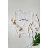 White sweatshirt made of organic cotton with colorful good embroidered text on front