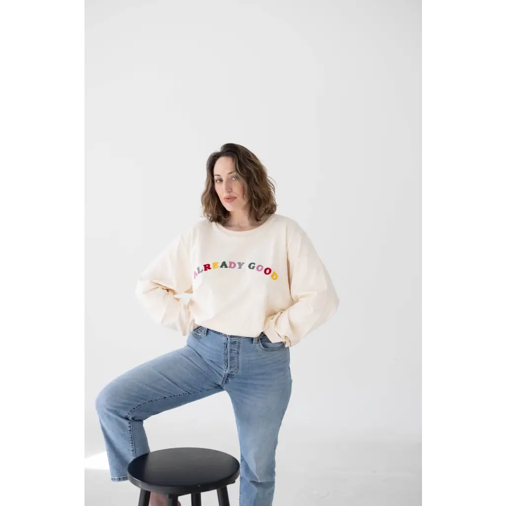 Cream-colored sweatshirt featuring colorful BRADY CREW text made from good embroidered organic cotton