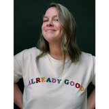 White t-shirt featuring colorful ALREADY GOOD text on an organic cotton sweatshirt
