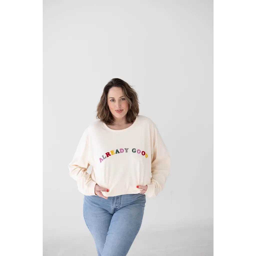 Cream sweatshirt with colorful ALREADY GOOD text, great for organic cotton lovers