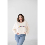 Cream sweatshirt with colorful ALREADY GOOD text, great for organic cotton lovers