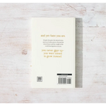 White book with gold text on back cover titled And Yet – Here You Are by Eileen Lamb