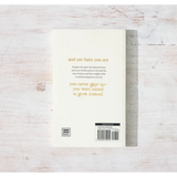 White book with gold text on back cover titled And Yet – Here You Are by Eileen Lamb