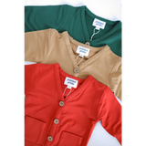 Three buttery soft baby grandpa cardigans in green, beige, and red for the holiday season