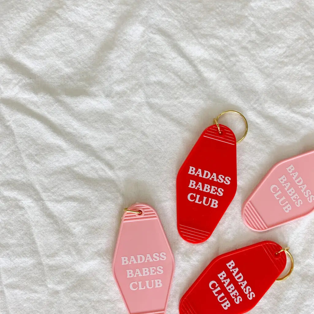 Retro motel key tags in pink and red for the Badass Babes Club hotel keychains