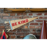 Tan Be Kind Pennant Flag with red lettering, perfect for stylish womens clothes and polished prints
