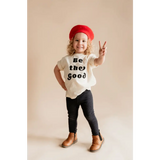 Child in a red beret rocking a Be the Good organic cotton graphic t-shirt by Polished Prints