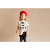 Child in a red beret rocks a Be the Good Organic Cotton Graphic T-shirt by Polished Prints