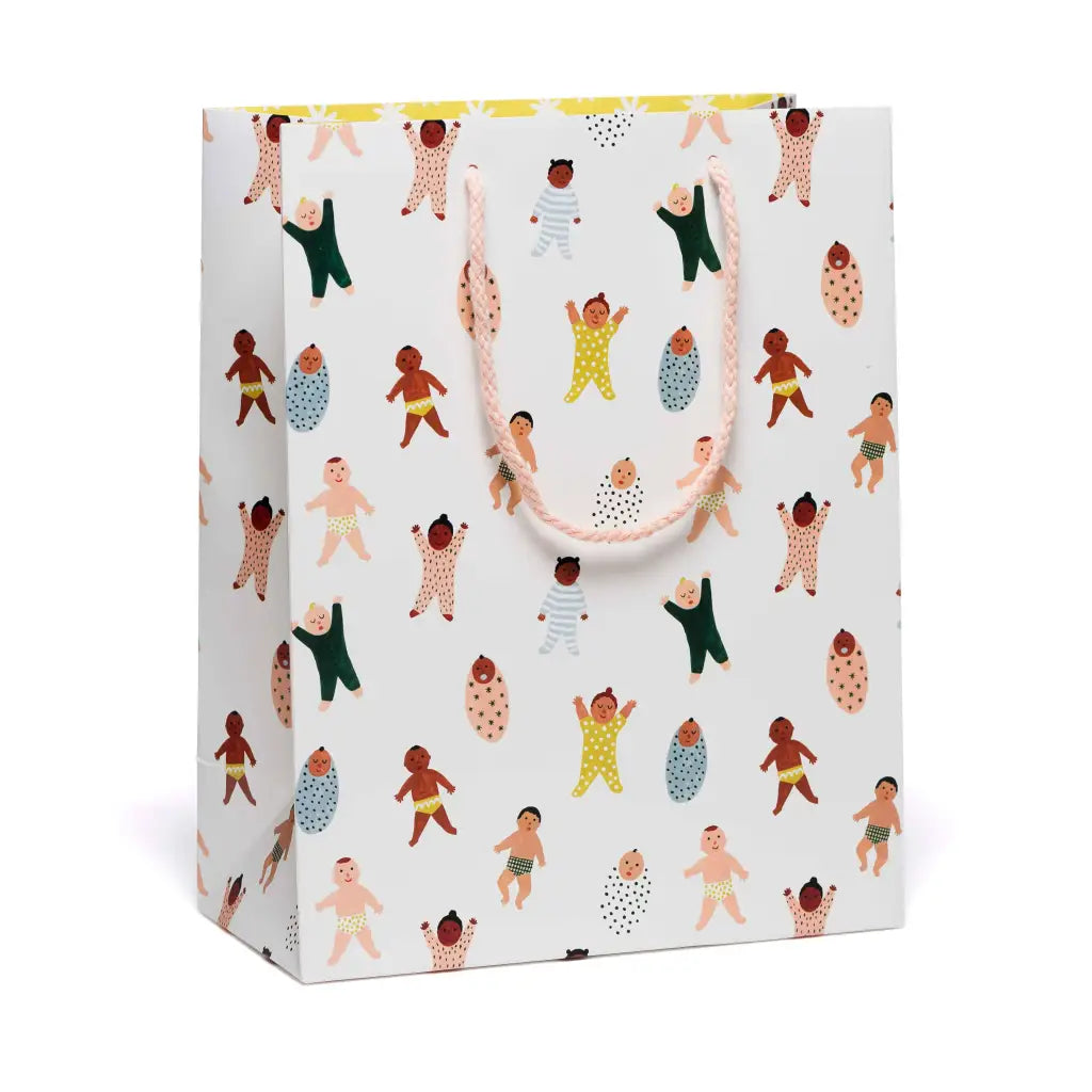 White gift bag with colorful baby illustrations and handles from Beautiful Baby gift bags featuring polished prints