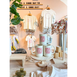 Three white 15oz extra large mugs with red text from Behind Every Woman collection