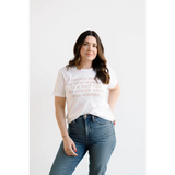 White unisex graphic tee celebrating dope ass women paired with blue jeans