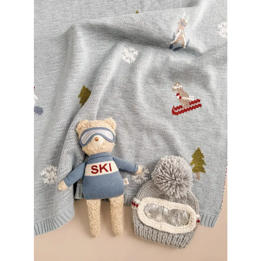 Benjamin Bear ski plushie in blue ski gear with a cool knitt hat and goggles ready for fun