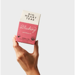 Pink hibiscus tea bags in Big Heart Tea Co. box, perfect for stylish womens clothes day pickup
