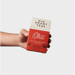 Box of Big Heart Teas Chai tea bags with stylish womens clothes and polished prints