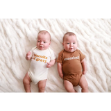 Two babies in Cute Biscuits and Gravy Meatball Baby Onesies made from organic cotton