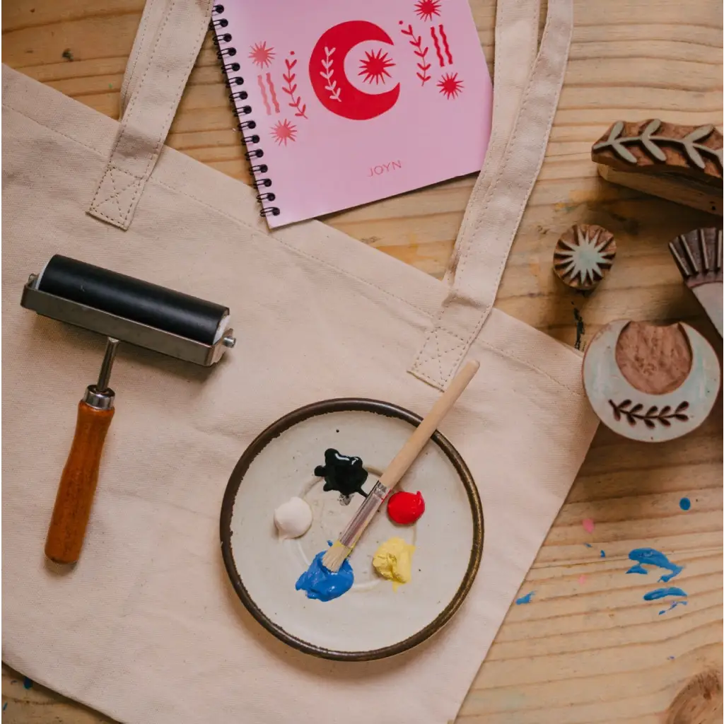 Crafting supplies for block printing on a Blok Parti Cosmic Print Tote Bag