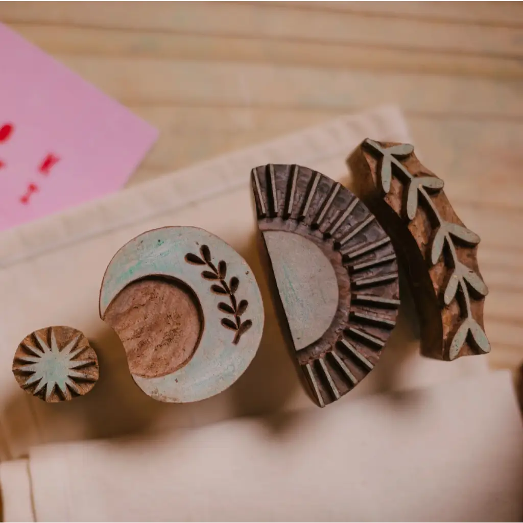 Assorted wooden printing blocks for blok parti block printing and polished prints in tote kit