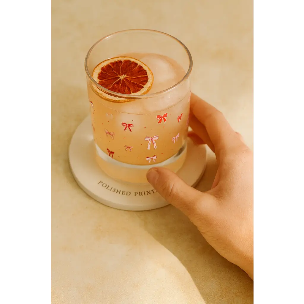 Pink bow glass with ice and orange slice, perfect for peace signs camp vibes