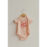Pink baby onesie with red Girls Club text for Brave Girls Club cuties