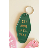 Bright green Cat Mom motel keychain with gold text, perfect for proud cat moms