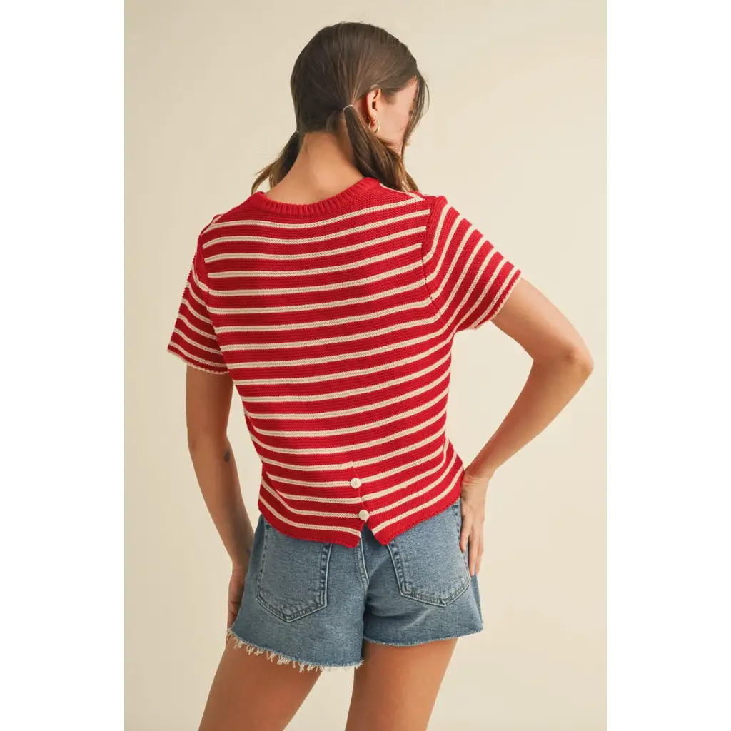Red and white short sleeve striped sweater top with button-up back for a casual look