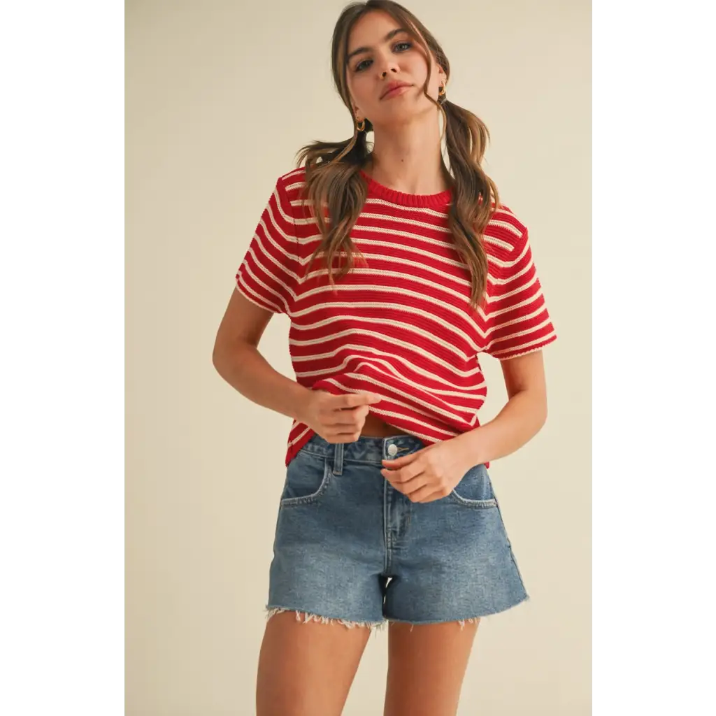 Red and white striped short sleeve sweater top with denim shorts for a casual look