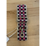 Pink and black checkered dog leash with metal hardware for stylish adjustable purse straps