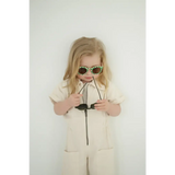 Child in beige jumpsuit rocking checkered baby kids sunnies for a cool style