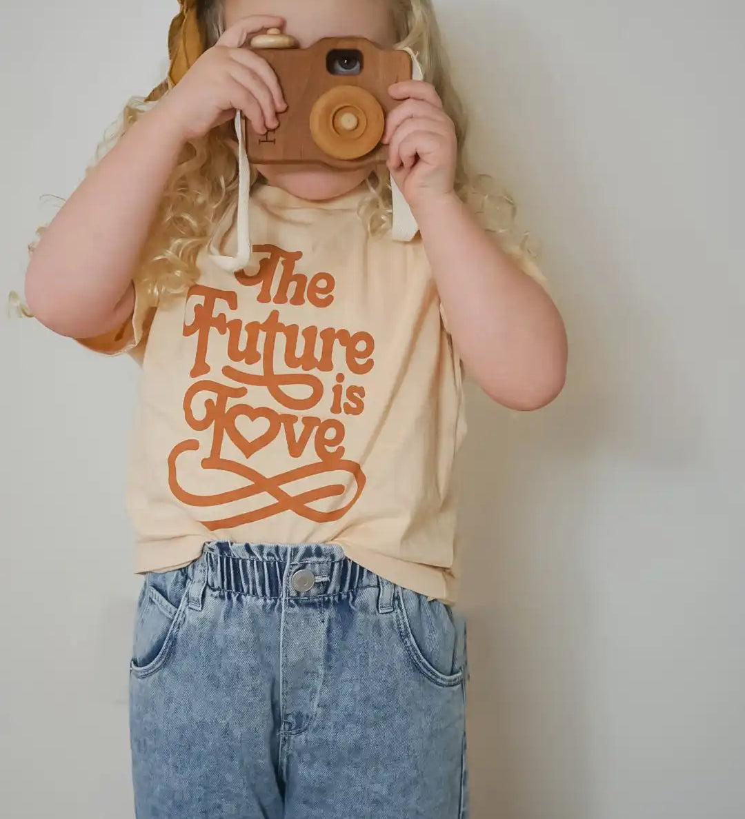 Child with toy camera.