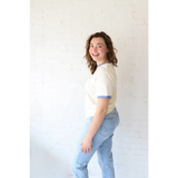 Woman in Classic Women’s Ringer Tee in Navy made with organic cotton and spandex means
