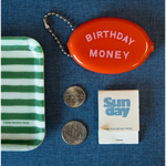 Orange coin purse for birthday money with a fun vintage-inspired design