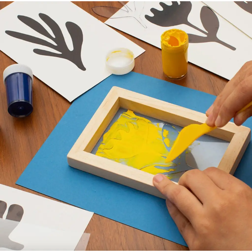 Screen printing frame with yellow paint for stylish womens clothes and polished prints