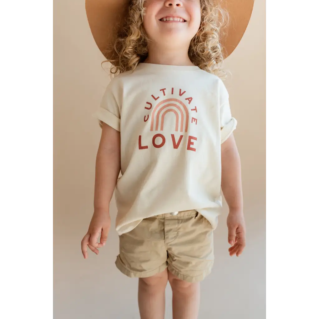 White Cultivate Love Organic Cotton T-shirt for Kids with rainbow arch design