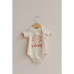 White baby onesie with Cultivate Love text and rainbow design in organic cotton