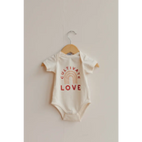 White baby onesie with Cultivate Love text and rainbow design in organic cotton