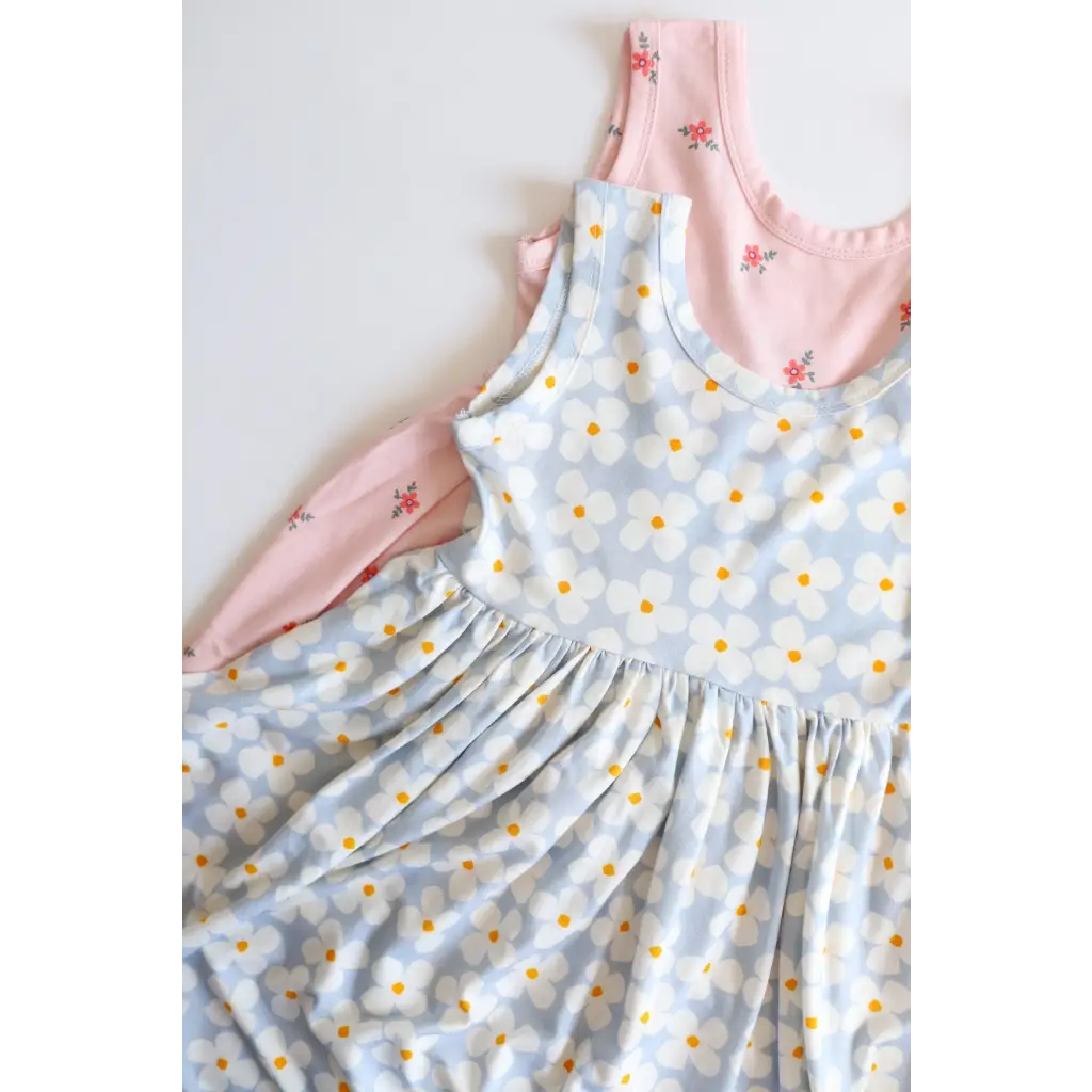 Light blue floral Daisy Twirl Dress with gathered waist and pink trim for fun outings