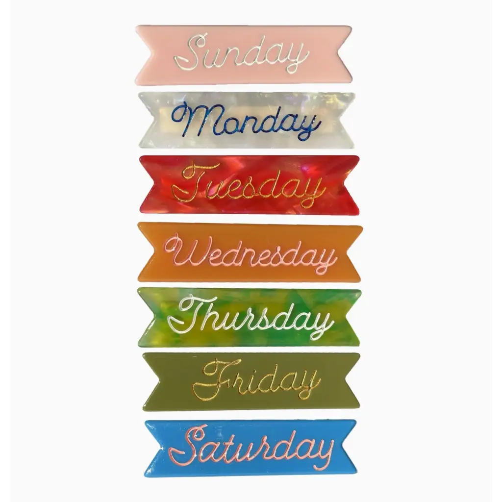 Seven colorful ribbon banners with days of the week on Cellulose Acetate clips