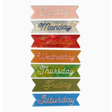Seven colorful ribbon banners with days of the week on Cellulose Acetate clips
