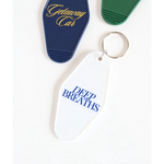 White vintage hotel keychain with Deep Breaths text in blue for calm moments