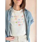 Light-colored short-sleeved T-shirt with colorful text worn under denim shirt at Craft Bar