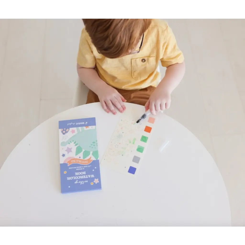 Child’s watercolor book with dinosaur theme, paint strip, and water brush for kids